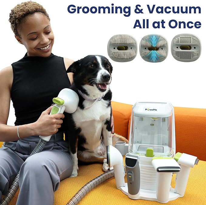 A cute woman grooming her black and white dog with vaccum kit